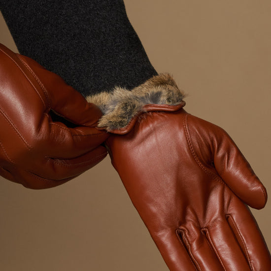 Brown leather glove cuff with visible plush fur lining detail