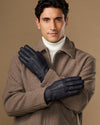 Men's navy goatskin leather gloves with wool lining, front view with hands crossed