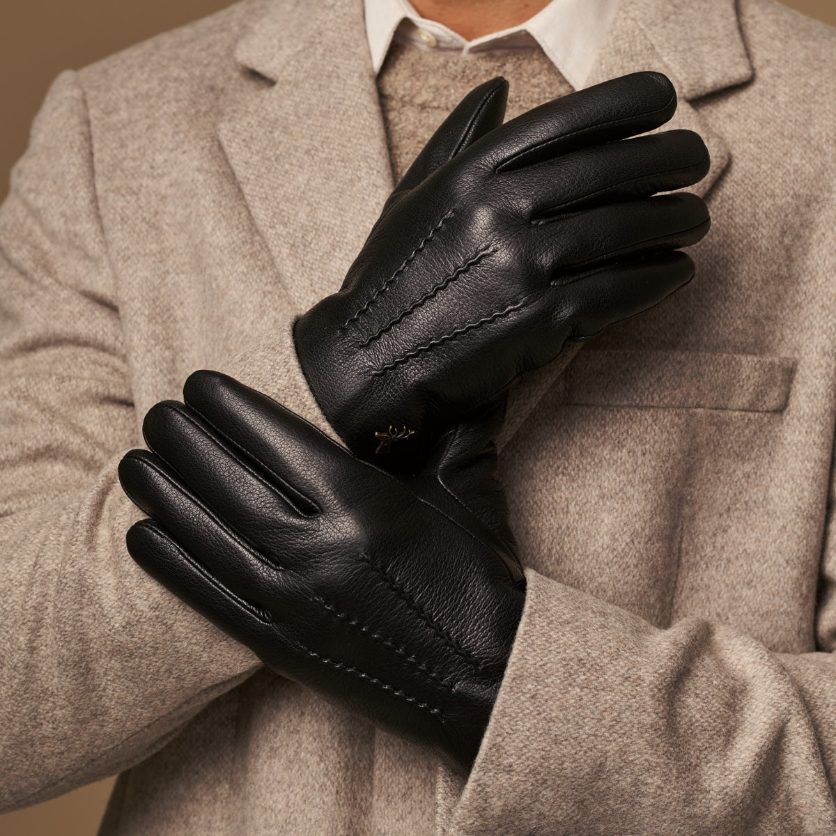 Hunter goatskin leather gloves in black, pair view, contrast stitching and curved fingertips