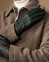 Dark green Jake sheepskin gloves with warm fleece lining, close-up on hand