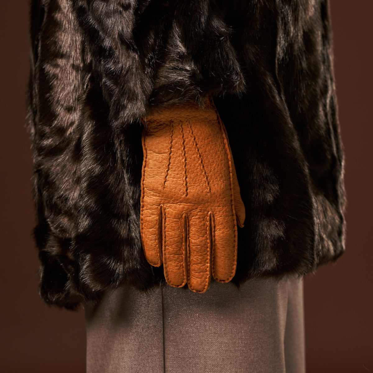 Cognac peccary leather women's glove with cashmere lining, finger seams visible