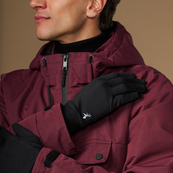 Black activity glove close-up showing its smooth back and small logo