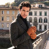 Man in dark coat wearing cognac brown peccary leather gloves