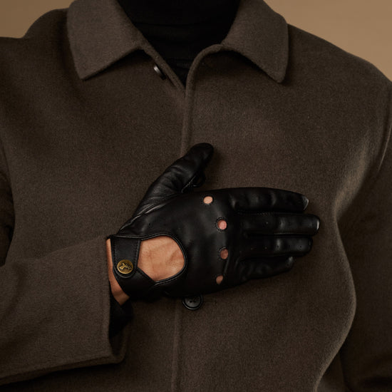 Black touchscreen leather gloves folded with palm panel and stud details