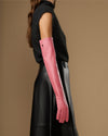 Women's pink leather gloves with long cuff, side view on arm