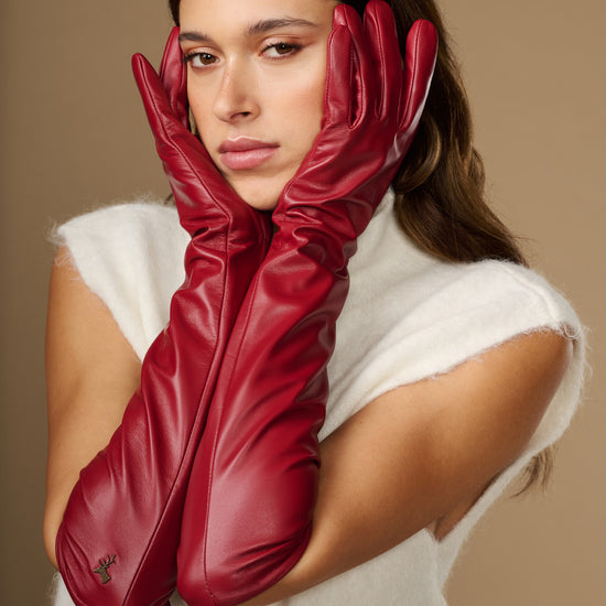 Red leather elbow gloves, close-up view of both hands