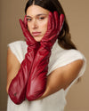 Red leather elbow gloves, close-up view of both hands
