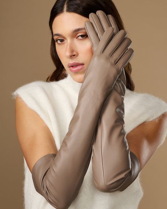 Close-up of taupe lambskin leather gloves with long cuffs and stitched fingers