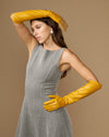 Yellow leather elbow-length glove with long cuff and stitched finger lines