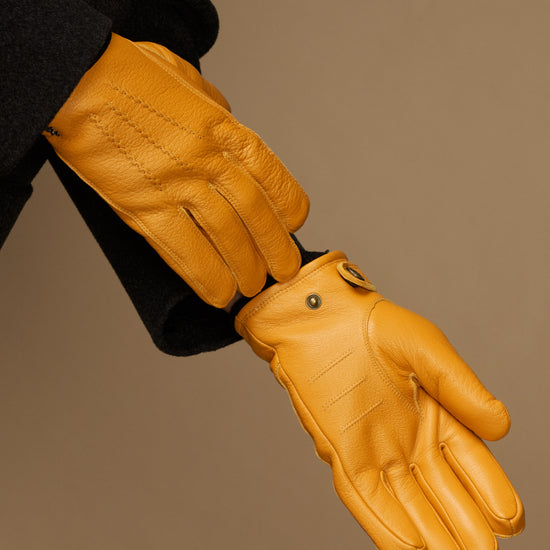 Yellow goatskin gloves with press-stud strap and fitted fingered cuff